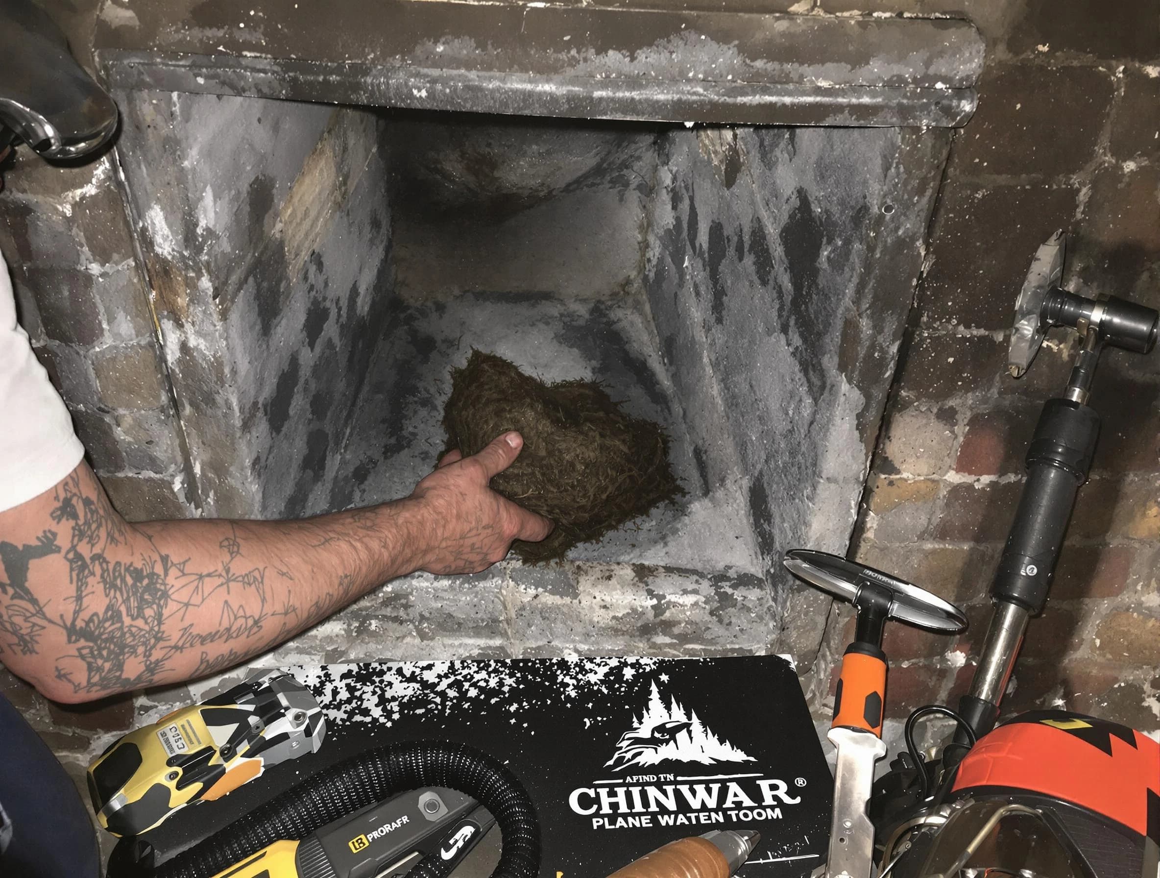 McCandless Chimney Sweep safely removing debris and screening chimney in McCandless, PA